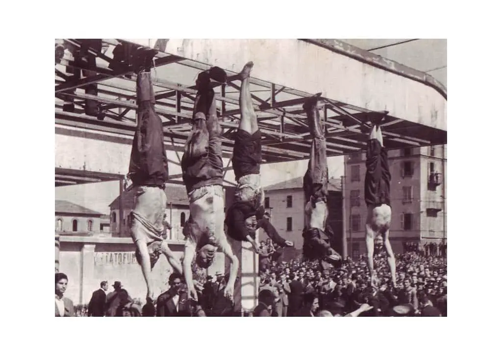 The bodies of Nicola Bombacci, Benito Mussolini, Claretta Petacci, Alessandro Pavolini, and Achille Starace strung up at Piazzale Loreto, Milano on 25 April 1945.