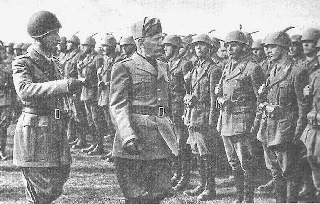 General Mario Carloni (L), Commander of the Monterosa Division reviews his troops with Benito Mussolini at the Münsingen training grounds.
