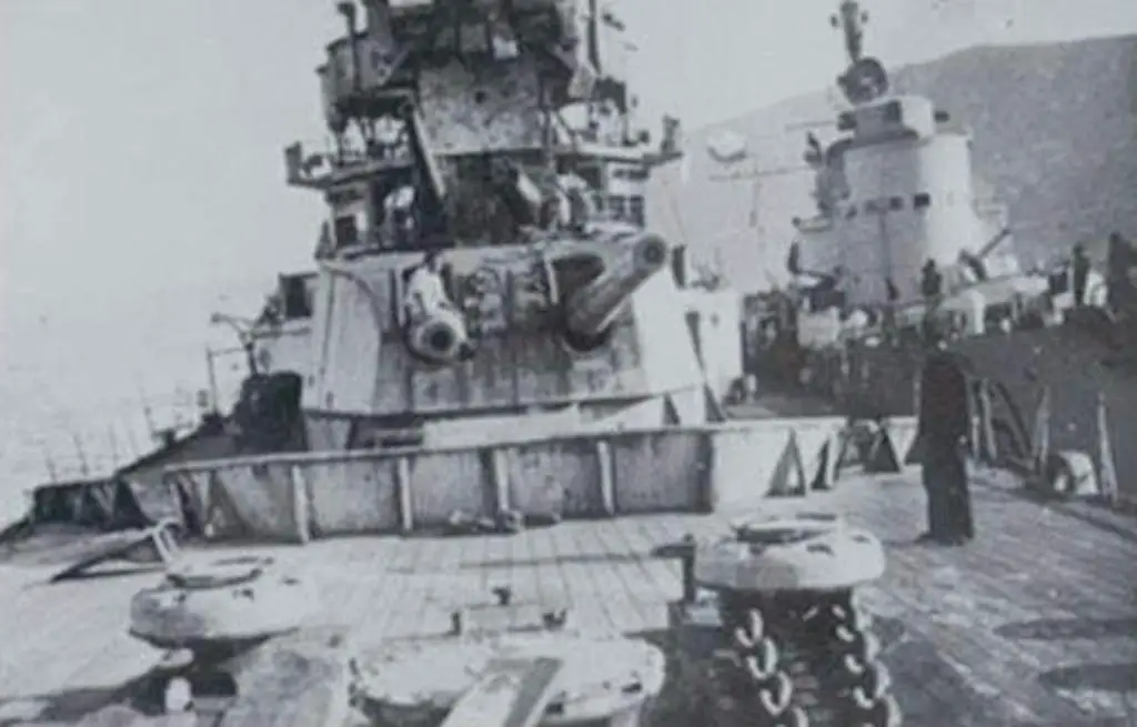 A photo of the crippled HMS York. The Italian torpedo boat Sirio is moored alongside.