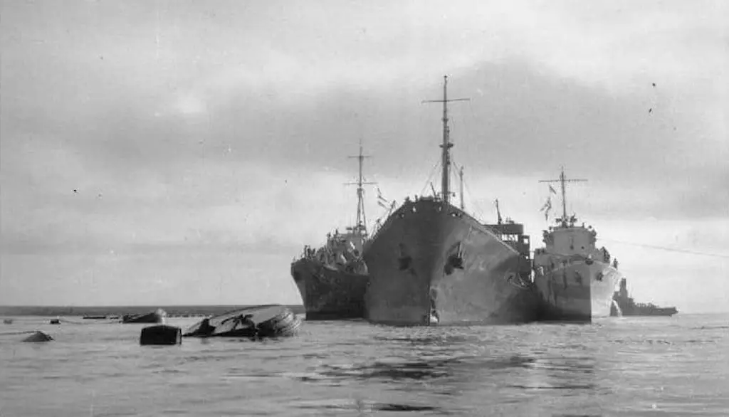 The severely damaged tanker Ohio arrives in Malta supported by two Royal Navy destroyers at the conclusion of Operation Pedestal.