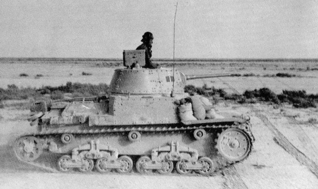 A Fiat M13/40 in North Africa. Notice the sandbags in the font being used for additional armor protection.