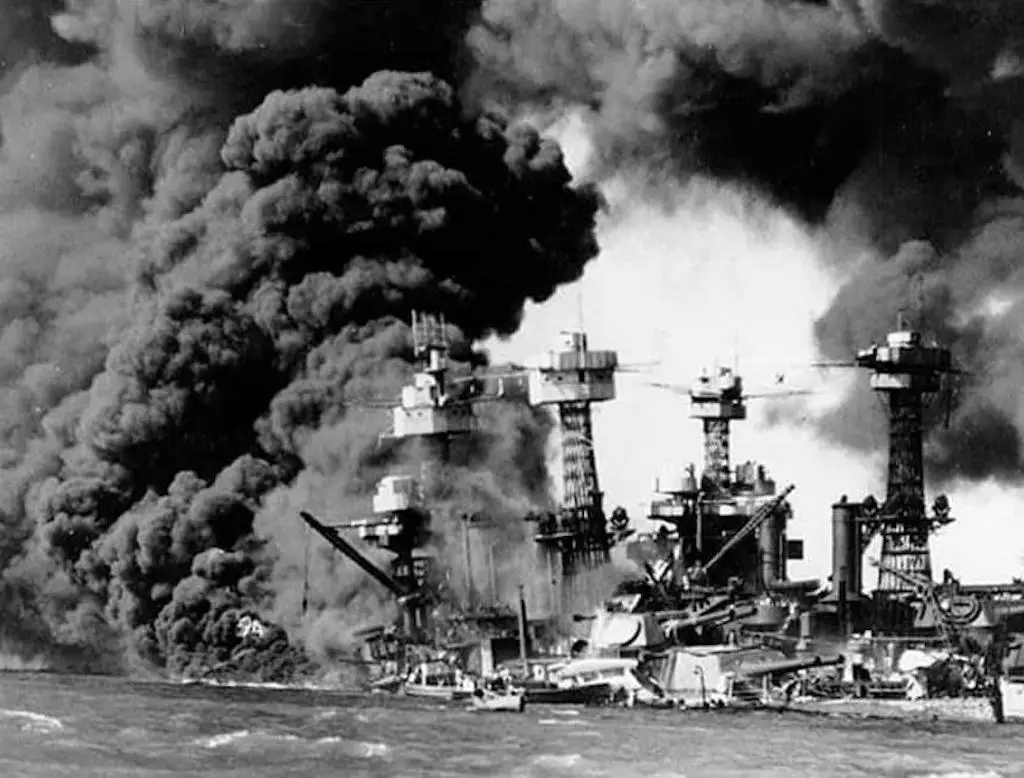 USS West Virginia and USS Tennessee burn following the attack on Pearl Harbor on Dec. 7, 1941. | REUTERS/KYODO