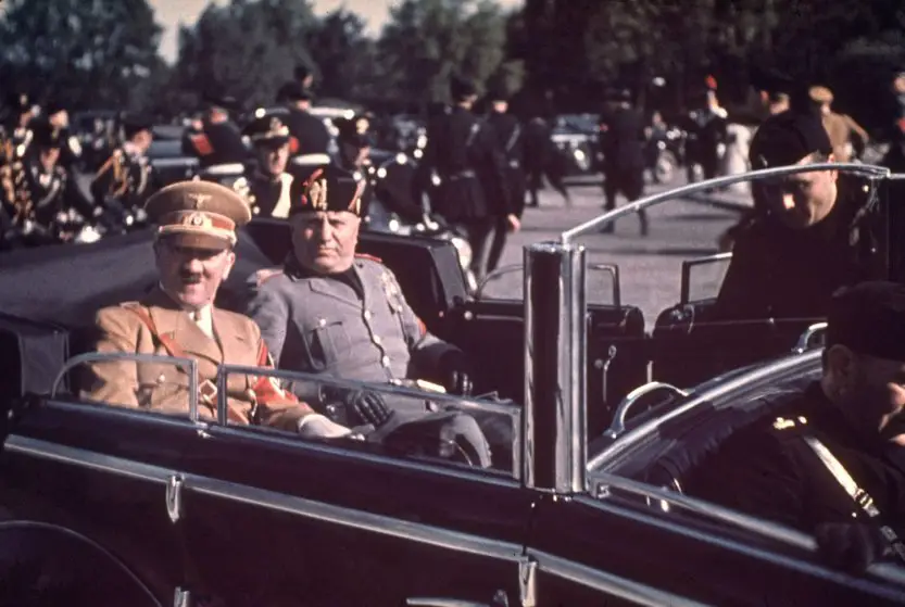 Adolf Hitler visits Benito Mussolini in Italy.