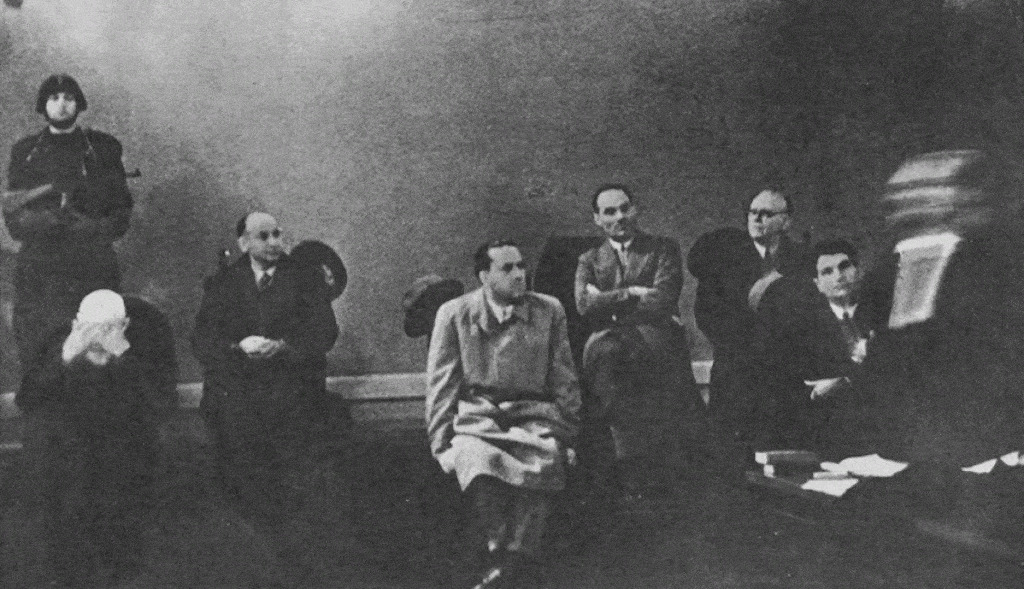 The Verona Trial of 1944. De Bono if far left with his hands of his head. To his left is Carlo Pareschi, Galeazzo Ciano, Luciano Gottardi, Giovanni Marinelli and Tullio Cianetti.