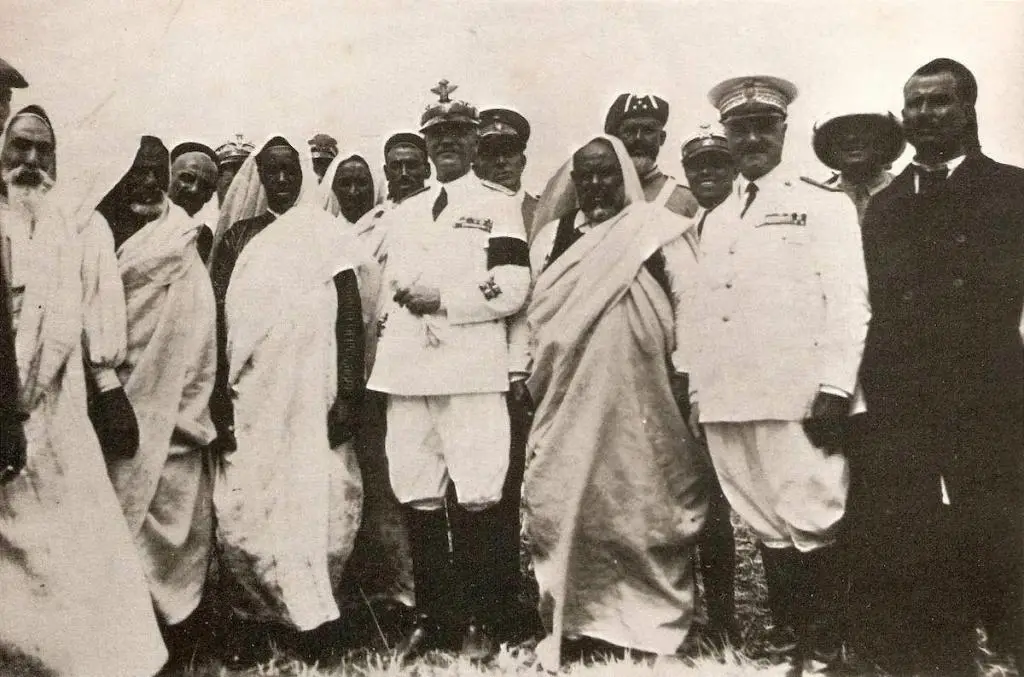 Badoglio (center) and Omar Muktar (2nd from left) after a negotiated compromise with the Senusite rebellion in Libya.