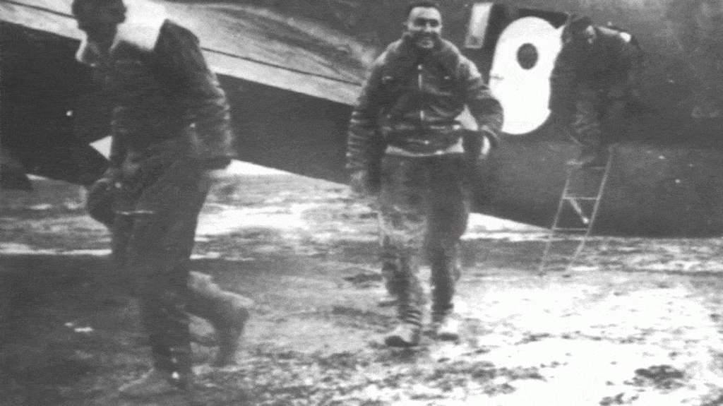 Paolo Moci (L) and Ettore Muti (R) exit their aircraft after completing the mission.