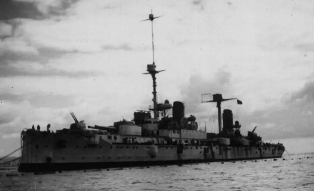 The old cruiser in the port of Tobruk.